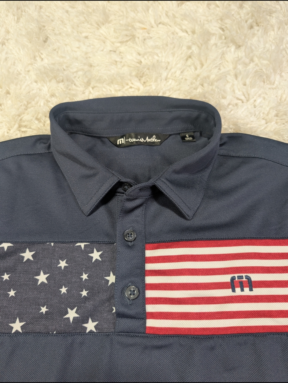 Travis Mathew Navy Polo with Red & White Flag Panels